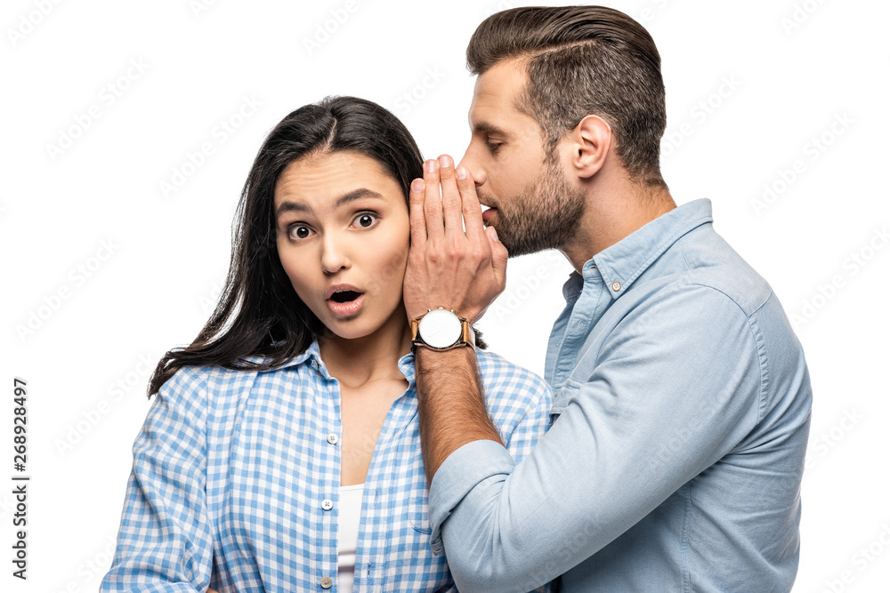 man telling secret to shocked young woman Isolated On White man telling secret to shocked young woman Isolated On White