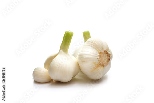 three garlic bulbs on a white background