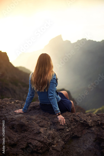 Young woman contemplating the road to Masca in Tenerife, Canary Islands, Spain