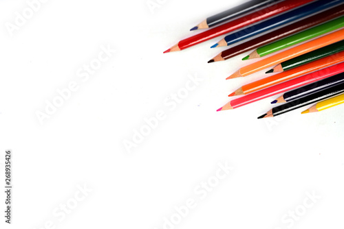 Multi color pencils are isolated on white background