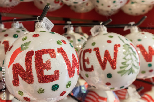 Christmas balls on red shelf are sold on a store at Lower Manhattan, New York City, USA