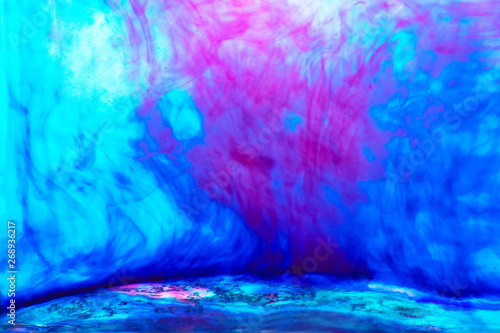 the background of the rich blue water with diluted purple paint