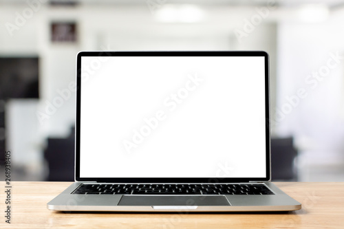 Laptop blank screen on wood table with office room background, mockup, template for your text