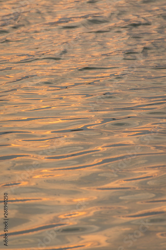 beautiful water wave pattern sunset with nice harmonic structure and reflections