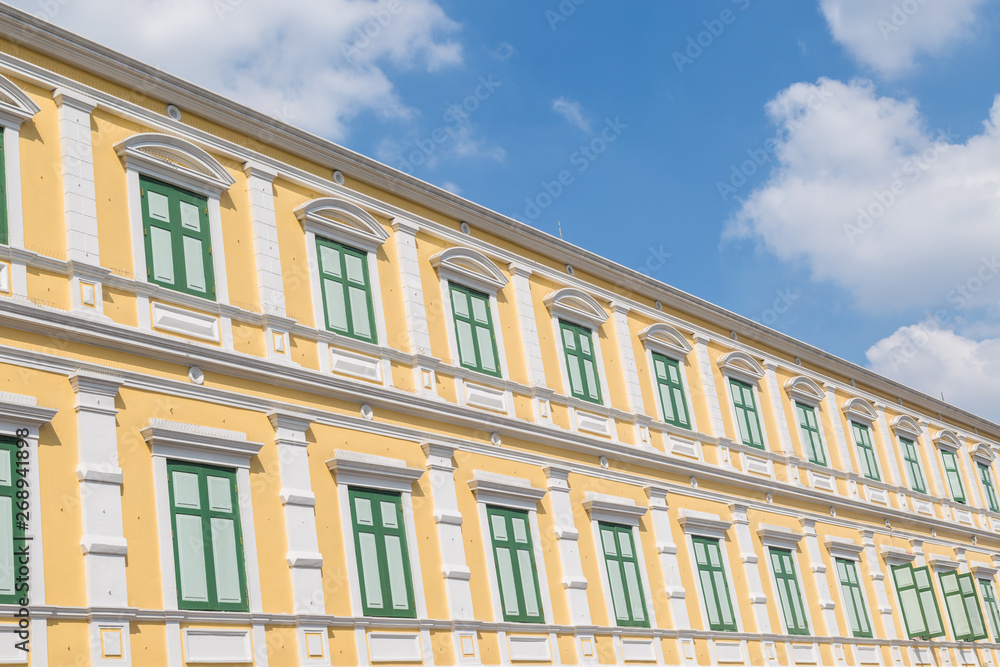 abstract row of the orange colored building with blue sky