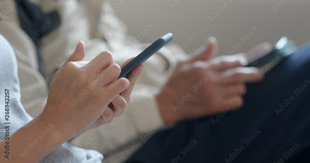 People use of mobile phone together at home People use of mobile phone together at home