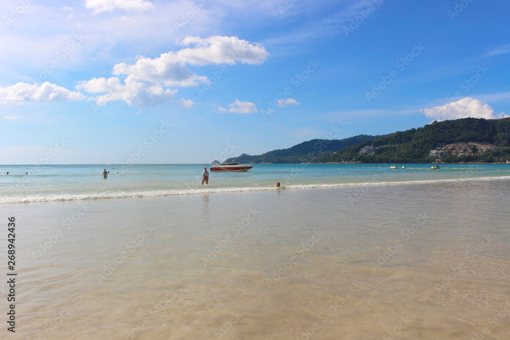 Phuket Province, Thailand - November17, 2017: Nai Harn Beach. Beautiful beach and sea in Phuket, Thailand. Traveller from around the world come to relax in the summer holidays. Phuket Province, Thailand - November17, 2017: Nai Harn Beach. Beautiful beach and sea in Phuket, Thailand. Traveller from around the world come to relax in the summer holidays.