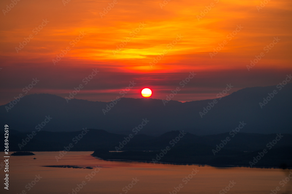 The natural background of the beautiful twilight sky, the surrounding atmosphere (trees, rivers, mountains) is a beautiful view of the journey, the view point. 