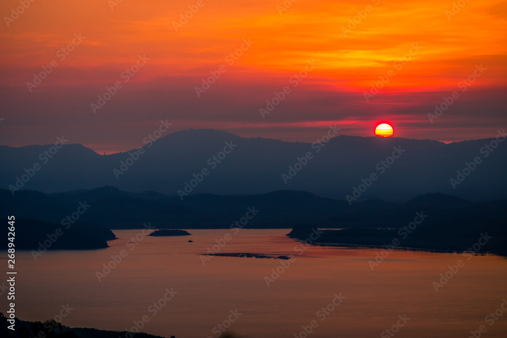 The natural background of the beautiful twilight sky, the surrounding atmosphere (trees, rivers, mountains) is a beautiful view of the journey, the view point. 