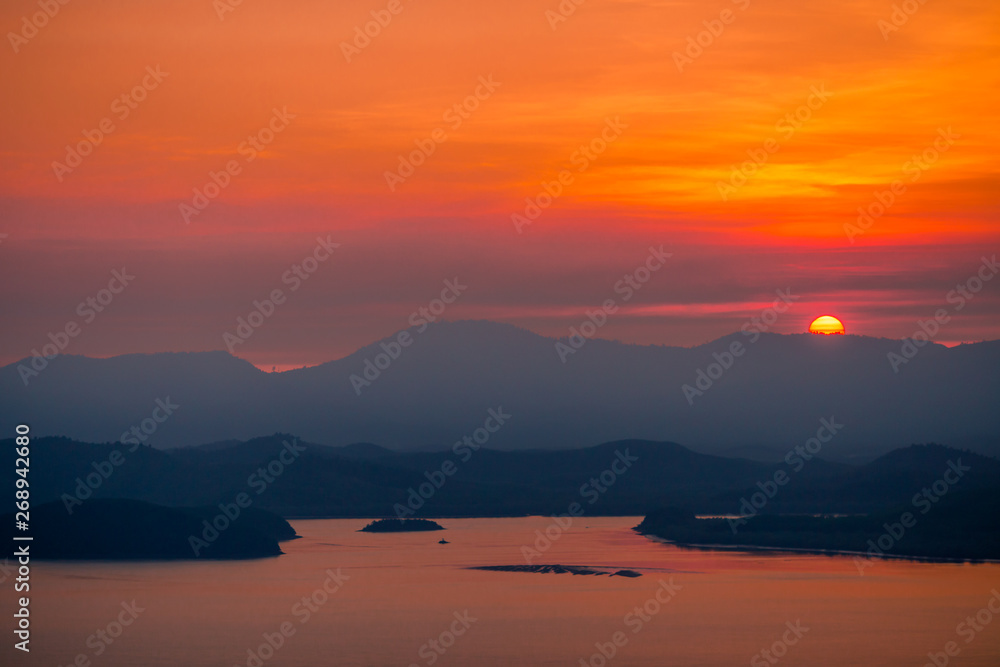 Fototapeta premium The natural background of the beautiful twilight sky, the surrounding atmosphere (trees, rivers, mountains) is a beautiful view of the journey, the view point.