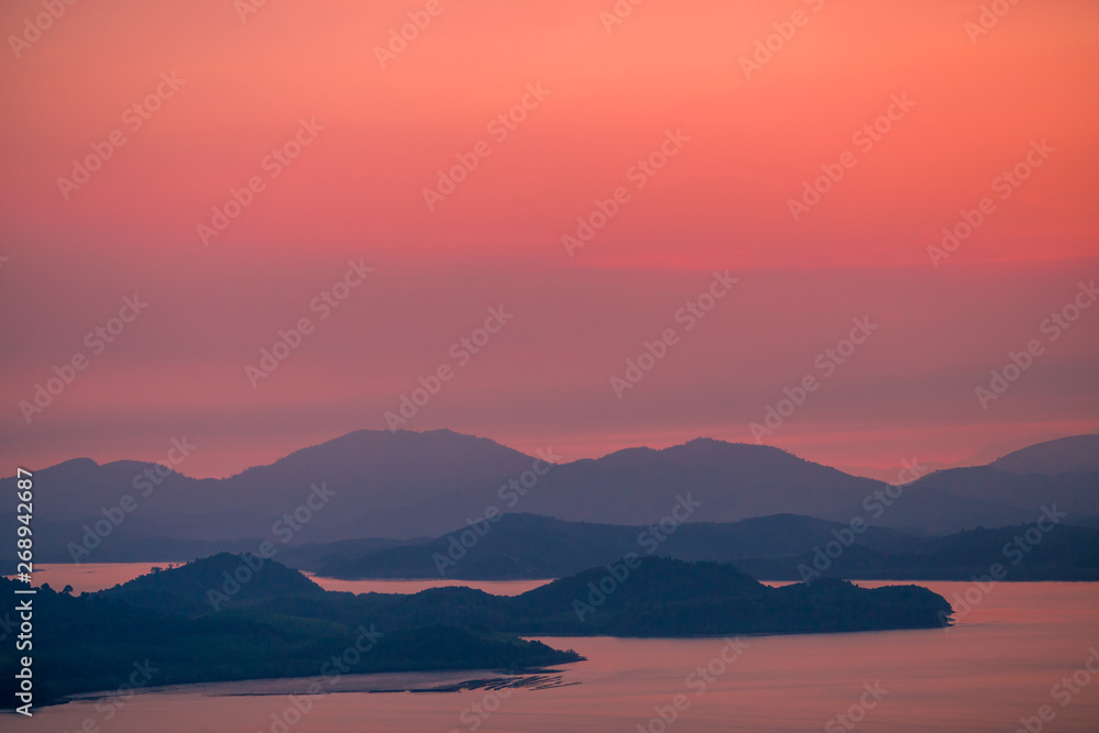 The natural background of the beautiful twilight sky, the surrounding atmosphere (trees, rivers, mountains) is a beautiful view of the journey, the view point. 