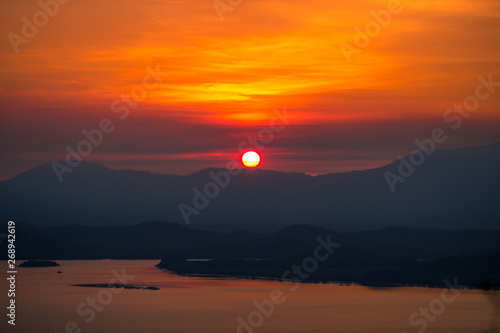 The natural background of the beautiful twilight sky, the surrounding atmosphere (trees, rivers, mountains) is a beautiful view of the journey, the view point. 