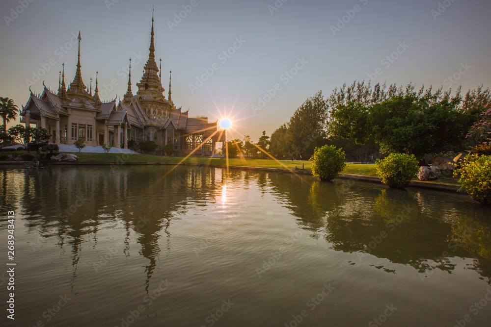 Wallpaper Wat Lan Boon Mahawihan Somdet Phra Buddhacharn(Wat Non Kum)is the beauty of the church that reflects the surface of the water, popular tourists come to make merit and take a public photo 