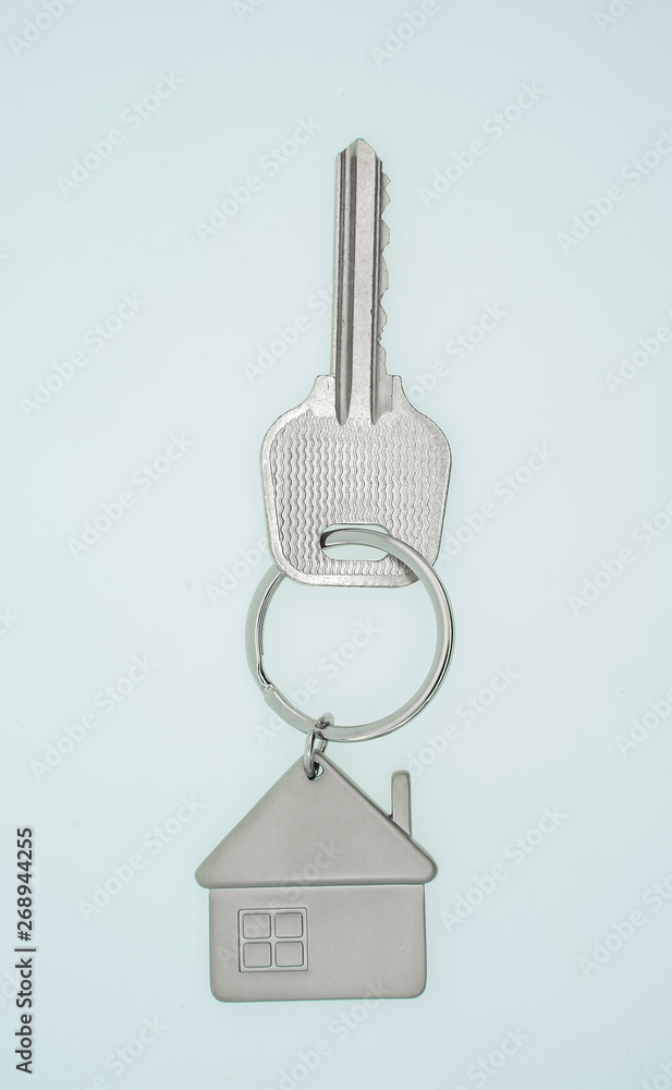 key chain with house symbol and keys on white background,Real estate concept key chain with house symbol and keys on white background,Real estate concept