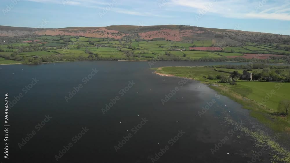 Llangorse Lake Drone aerial view of the welsh mountains on a summer's day in Wales Llangorse Lake Drone aerial view of the welsh mountains on a summer's day in Wales