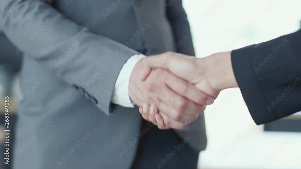 Close up slow motion scene video of business people hands shake together. Close up slow motion scene video of business people hands shake together.