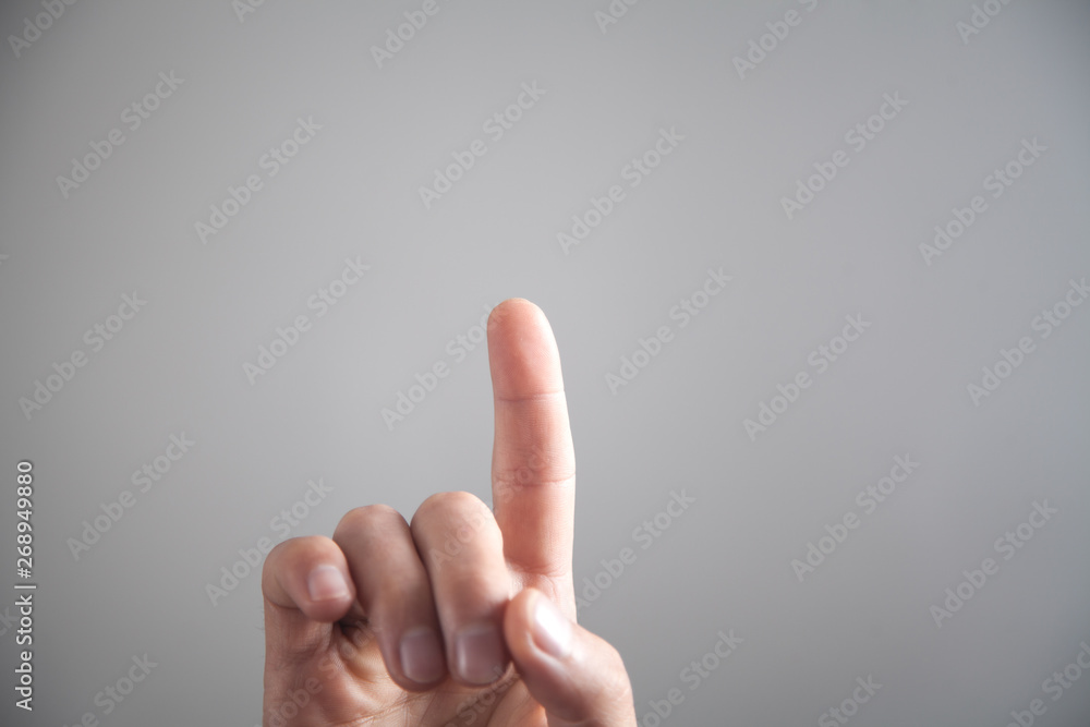 Male hand pointing or touching finger in screen. Male hand pointing or touching finger in screen.