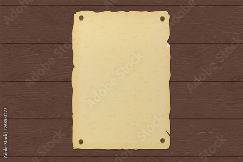 Old ripped brown paper poster nailed to a wooden wall.