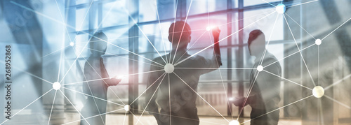Blockchain network on blurred skyscrapers background. Financial technology and communication concept.