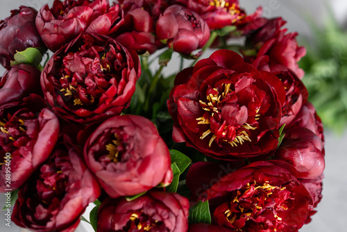 Fototapeta Naklejka Na Ścianę i Meble -  Red peonies in a metal vase. Beautiful peony flower for catalog or online store. Floral shop concept . Beautiful fresh cut bouquet. Flowers delivery