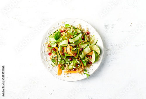 Cucumber, carrot , sugar pea and quinoa salad with pomegranate seeds