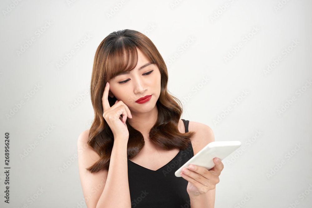 Portrait of a happy asian businesswoman using mobile phone isolated over white background Portrait of a happy asian businesswoman using mobile phone isolated over white background