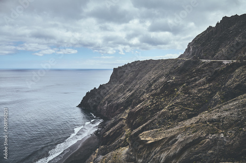 Vintage toned picture of Tenerife mountainous coast on a cloudy day, Spain.