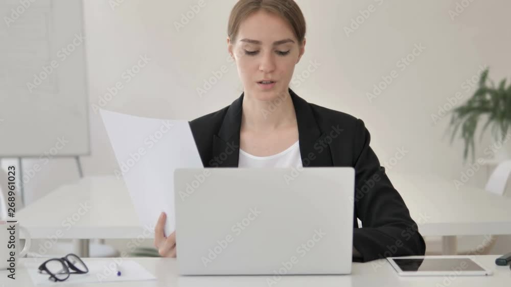Paperwork, Young Businesswoman Working on Documents and Laptop Paperwork, Young Businesswoman Working on Documents and Laptop