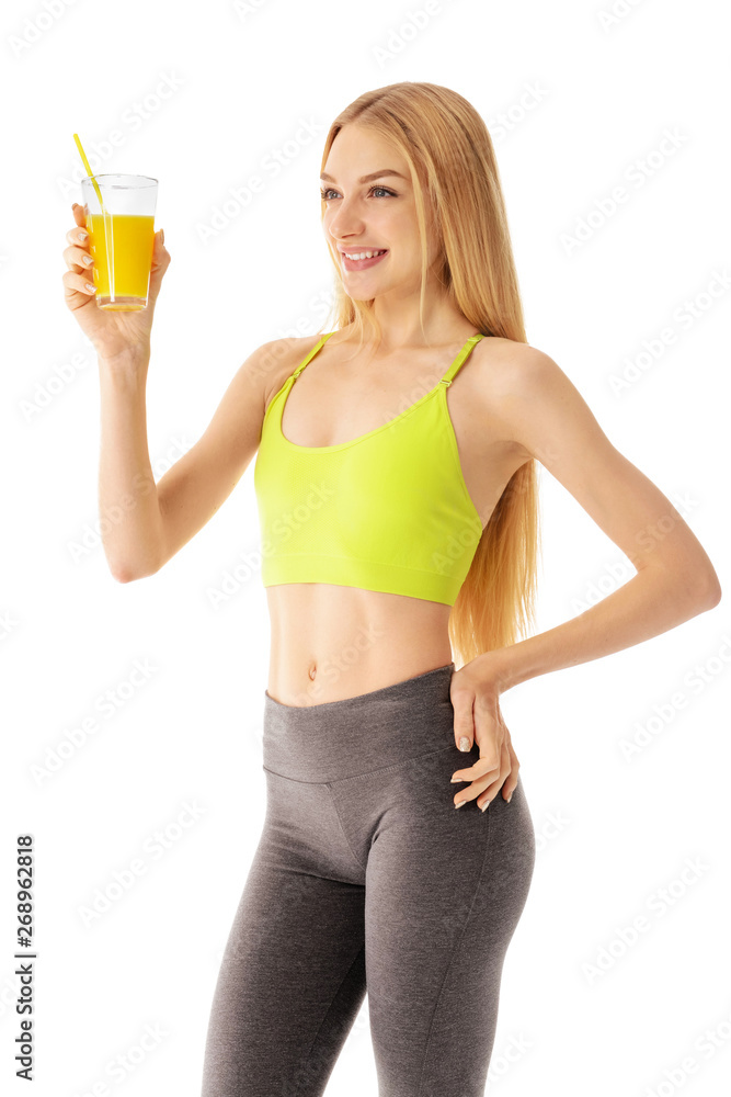 Sporty young woman with glass of juice on white background Sporty young woman with glass of juice on white background