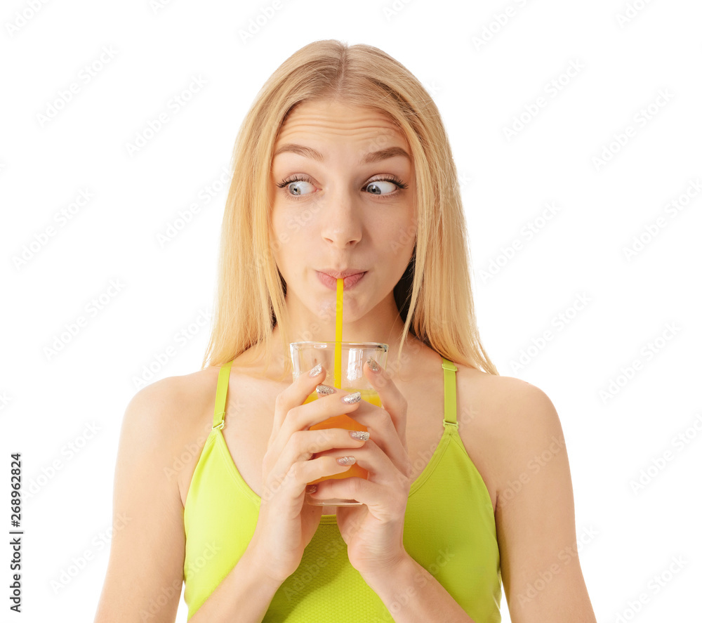 Sporty young woman with glass of juice on white background Sporty young woman with glass of juice on white background