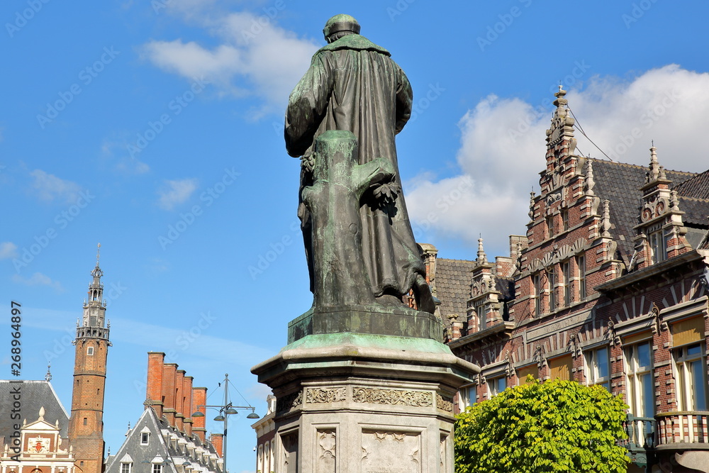 The Grote Markt Square with ornate and colorful traditional buildings in Haarlem, Netherlands, and with the statue of Laurens Janszoon Coster (erected in 1722) in the foreground