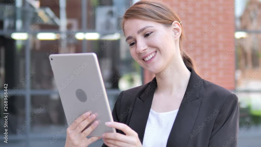 Outdoor Video Chat on Tablet by Young Businesswoman Outdoor Video Chat on Tablet by Young Businesswoman