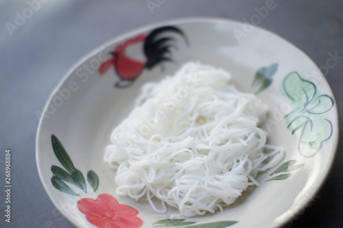 Nam Nguan Noodle, Rice noodles with spicy pork sauce. photo