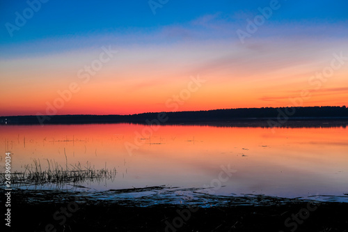Landscape with the image of lake Seliger in Russia at sunset