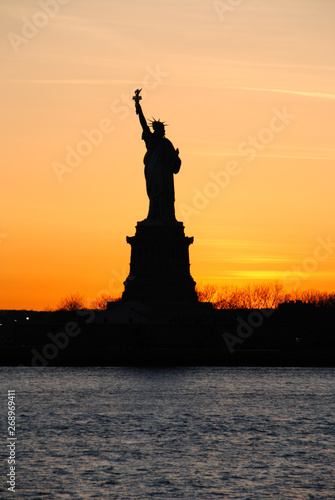 Amazing view of the Statue of Liberty, at sunset © raulhernaizcao