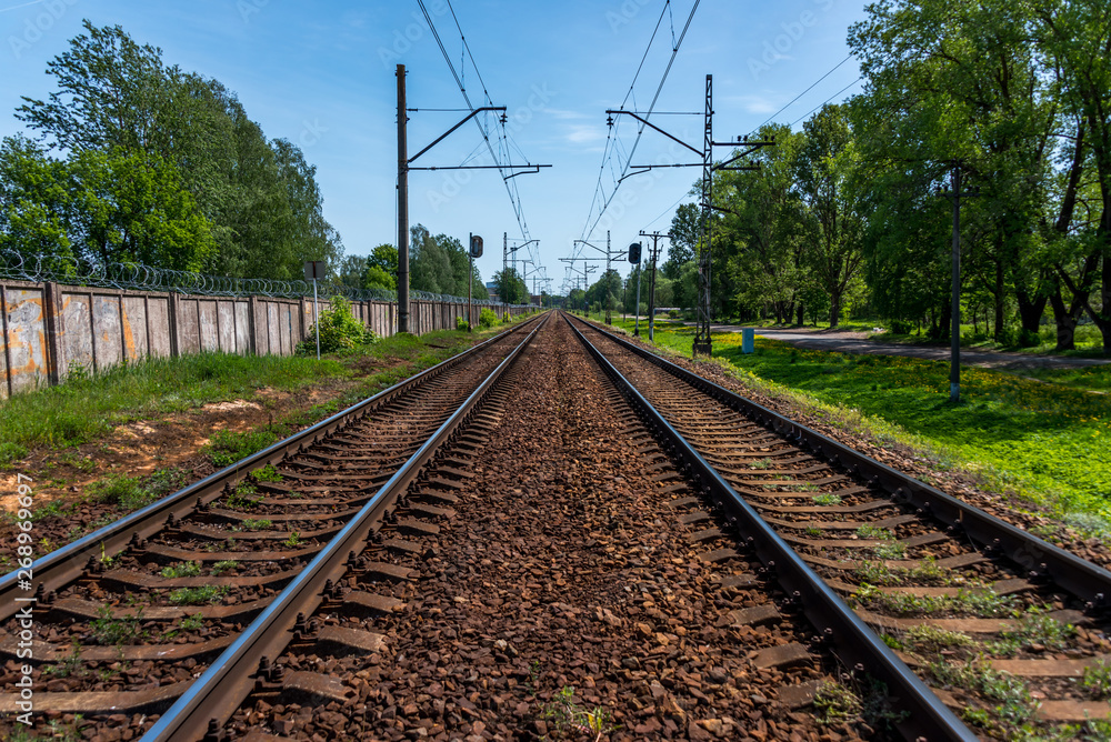 Railroad Tracks for Electric Train in Riga, Latvia on a Clear Sunny Day