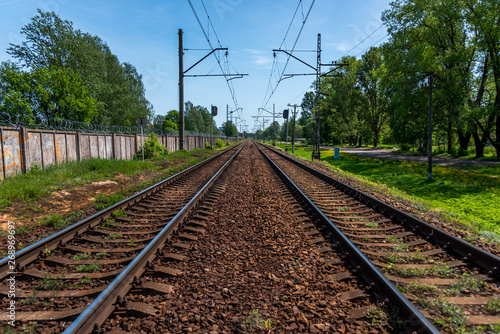 Railroad Tracks for Electric Train in Riga, Latvia on a Clear Sunny Day © JonShore