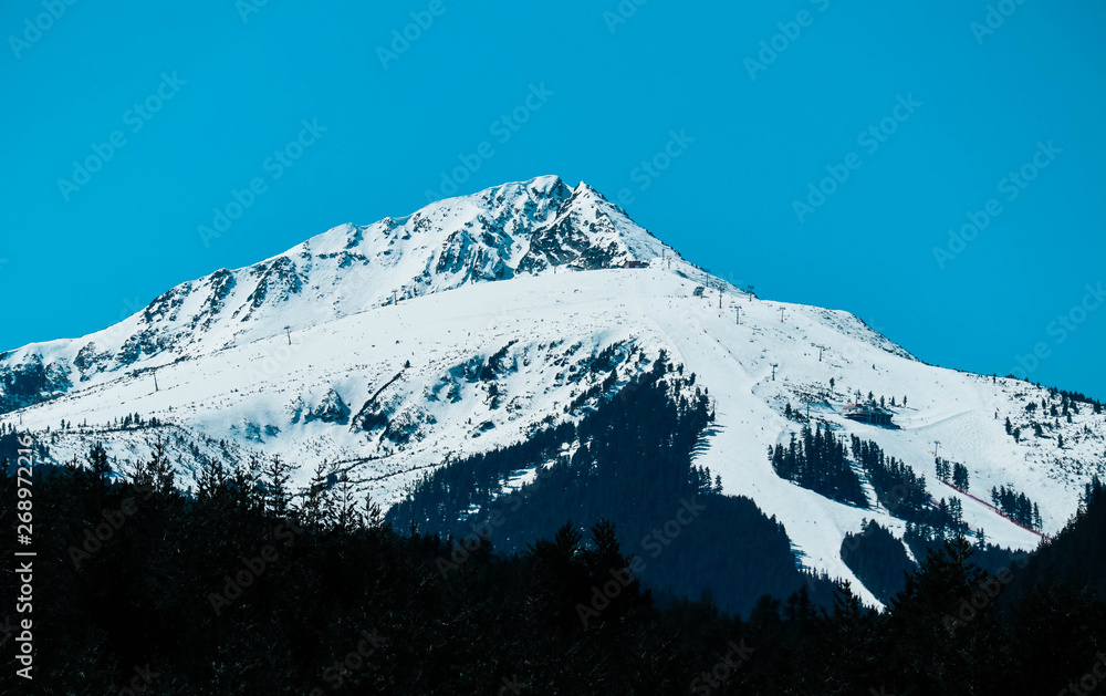 Todorka Mountain snow peak, beautiful natural winter backdrop. Ice top of the hill, blue sky background. Pirin landscape.