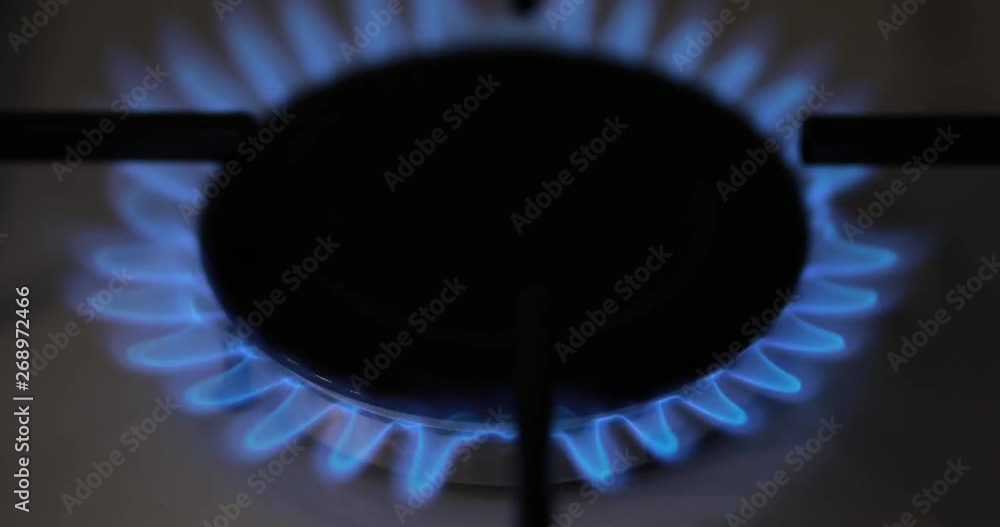 Igniting Of Natural Gas On Kitchen Stove, Close Burner Igniting Of Natural Gas On Kitchen Stove, Close Burner