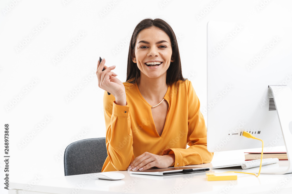 Portrait of attractive young designer woman using graphic tablet computer and stylus pen in bright office Portrait of attractive young designer woman using graphic tablet computer and stylus pen in bright office
