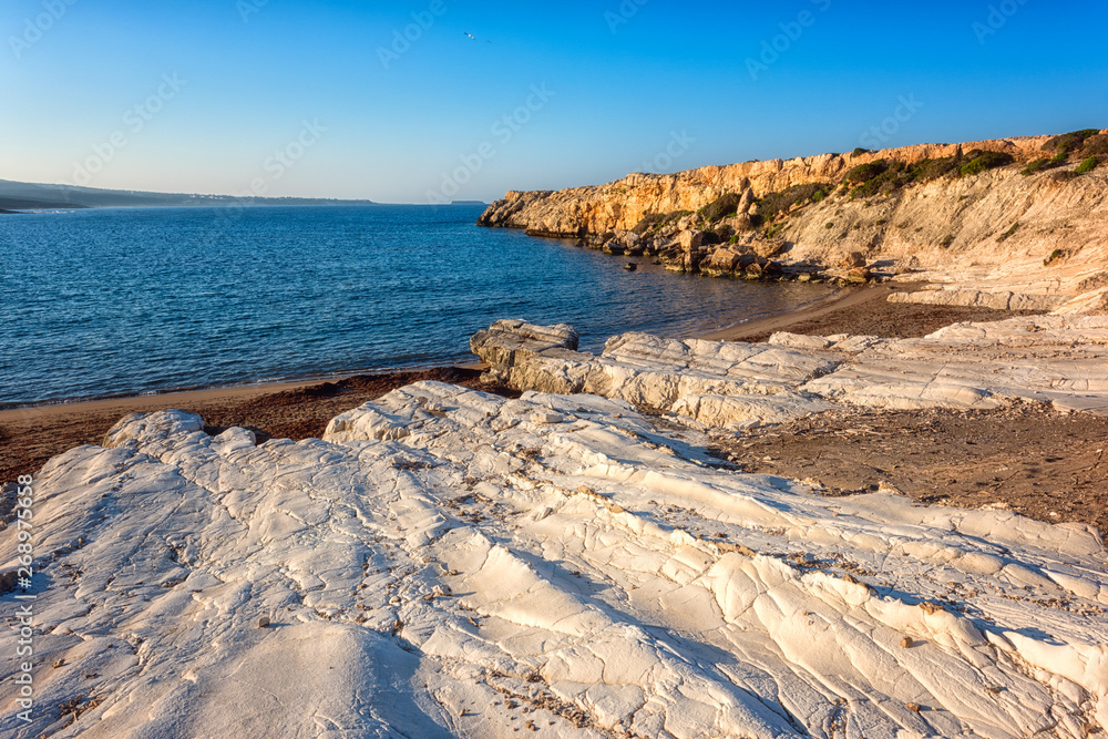 Chalk beach on Cyprus, scenic morning seascape with white rocks, blue sea and sky, outdoor travel background