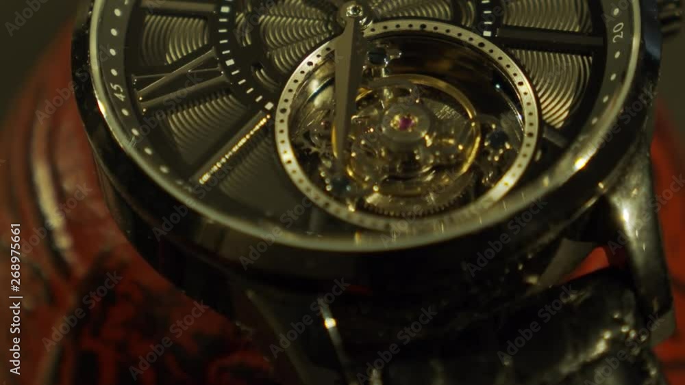 Beautiful watch movement on a beautiful red tea pot. Beautiful watch movement on a beautiful red tea pot.