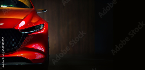Red modern car headlights on black background  photo