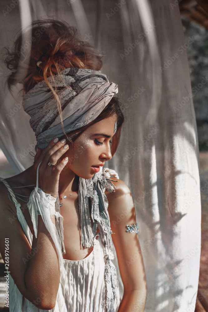 beautiful young woman in turban at natural tropical background beautiful young woman in turban at natural tropical background