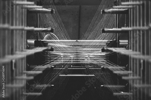 Textile factory machine weaving close up