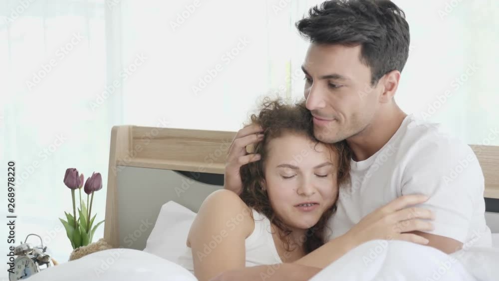Communication is what makes understanding. Couples are sitting talking on the bed in the morning of the summer. Which has clear, cool air Makes living a happy life Concept of life insurance Communication is what makes understanding. Couples are sitting talking on the bed in the morning of the summer. Which has clear, cool air Makes living a happy life Concept of life insurance
