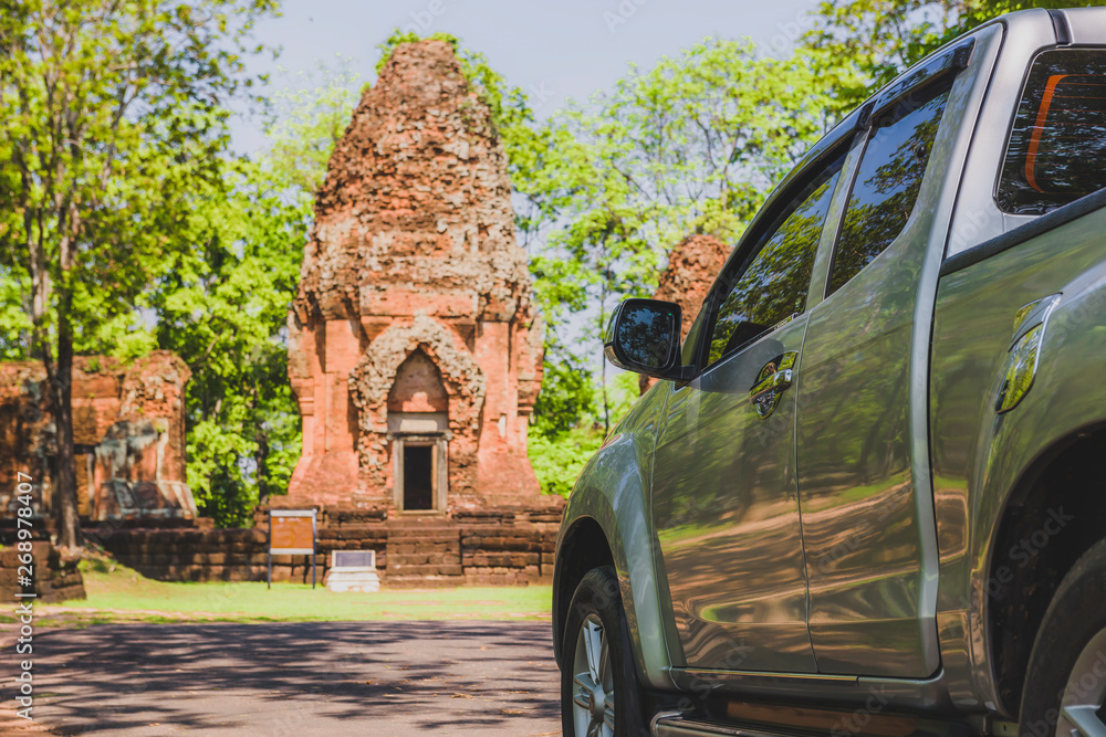 Fototapeta premium Tourists use cars to explore Khmer castles, ancient Prang Ku Suan Taeng, in Buriram, Thailand.