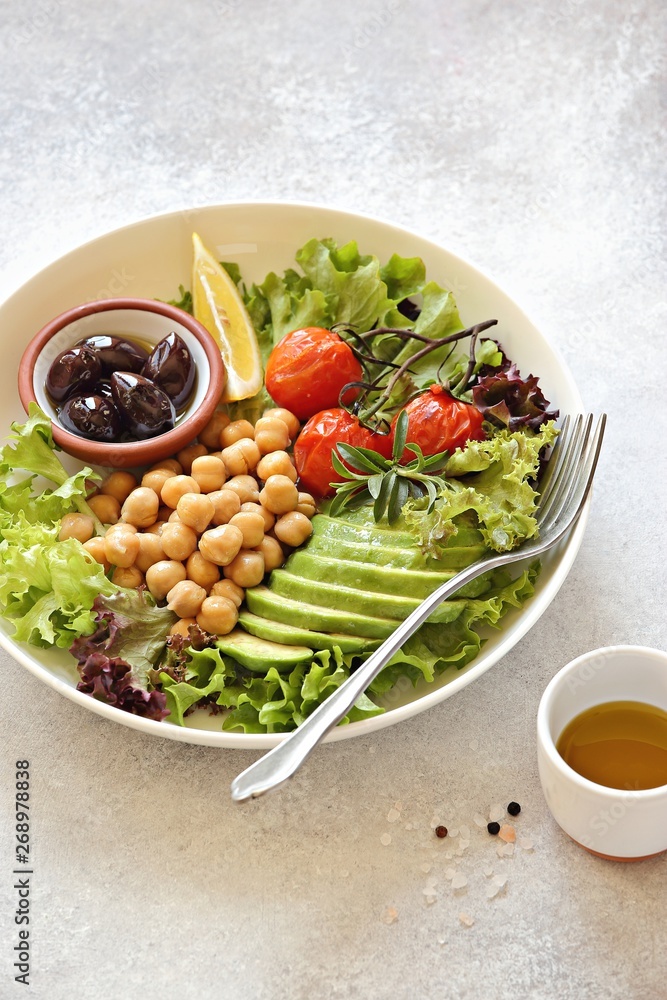 Detox salad with chick pea, avocado, grilled tomatoes and olives. Healthy salad bowl for super food, clean eating, plant based diet concepts. Detox salad with chick pea, avocado, grilled tomatoes and olives. Healthy salad bowl for super food, clean eating, plant based diet concepts.
