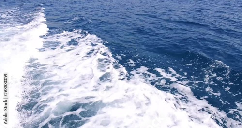 Wallpaper Mural Luxury yacht is sailing in the sea, big foamy waves diverge from the keel and sides of the yacht. Mountains are seen from board Torontodigital.ca