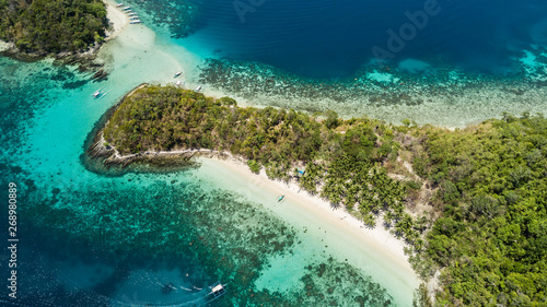 Top view of small tropical island in the Philippines. Island hopping tour in Port Barton